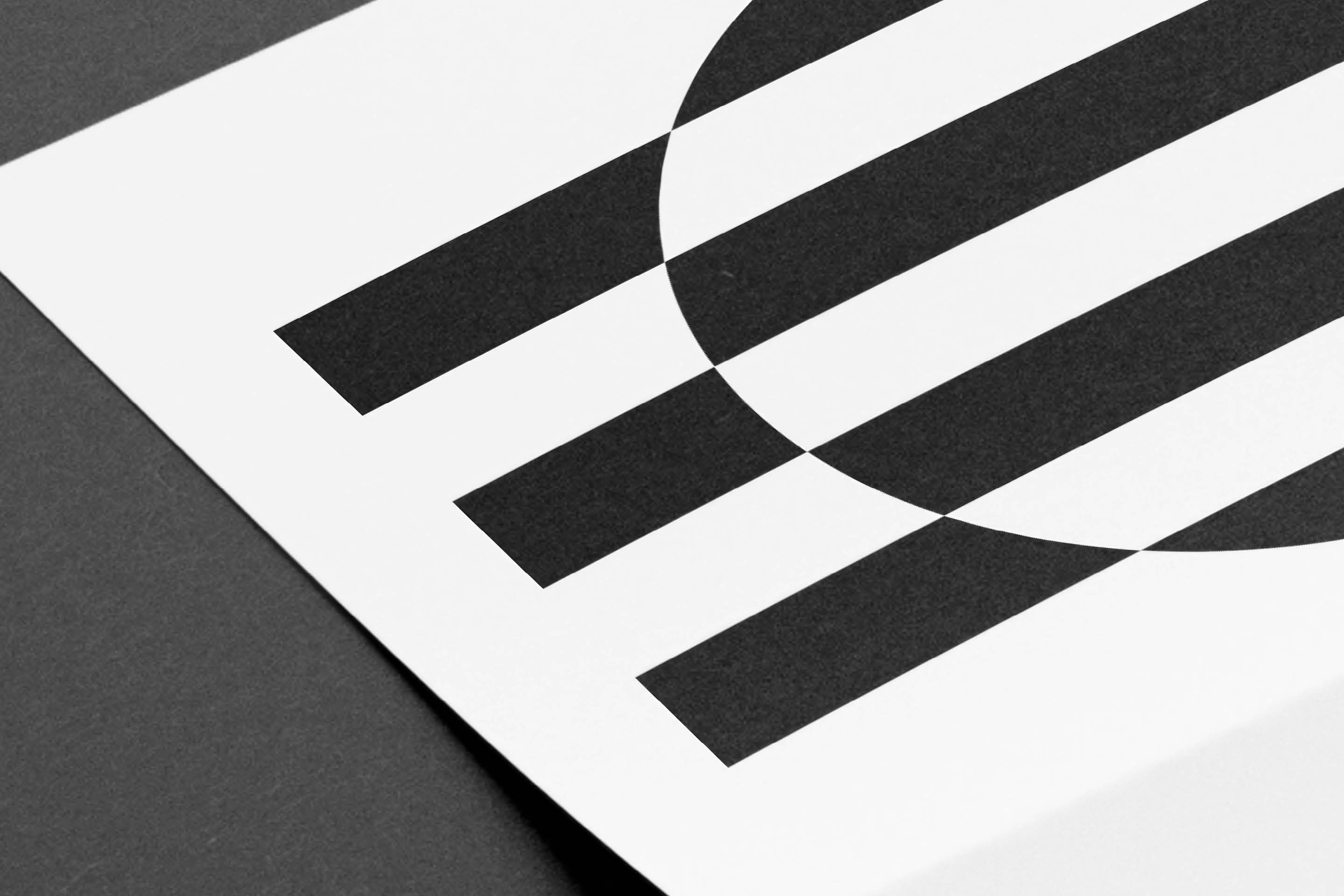 Minimal logo with circle intersected by vertical bars suggesting constrained figure