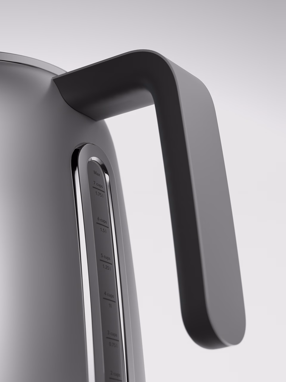 close-up kettle handle with matte metal surface and soft light
