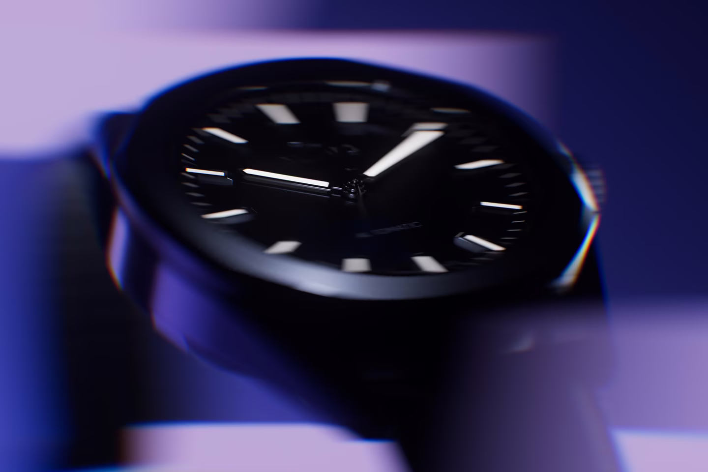 blurred watch prototype under colored light showing form and depth