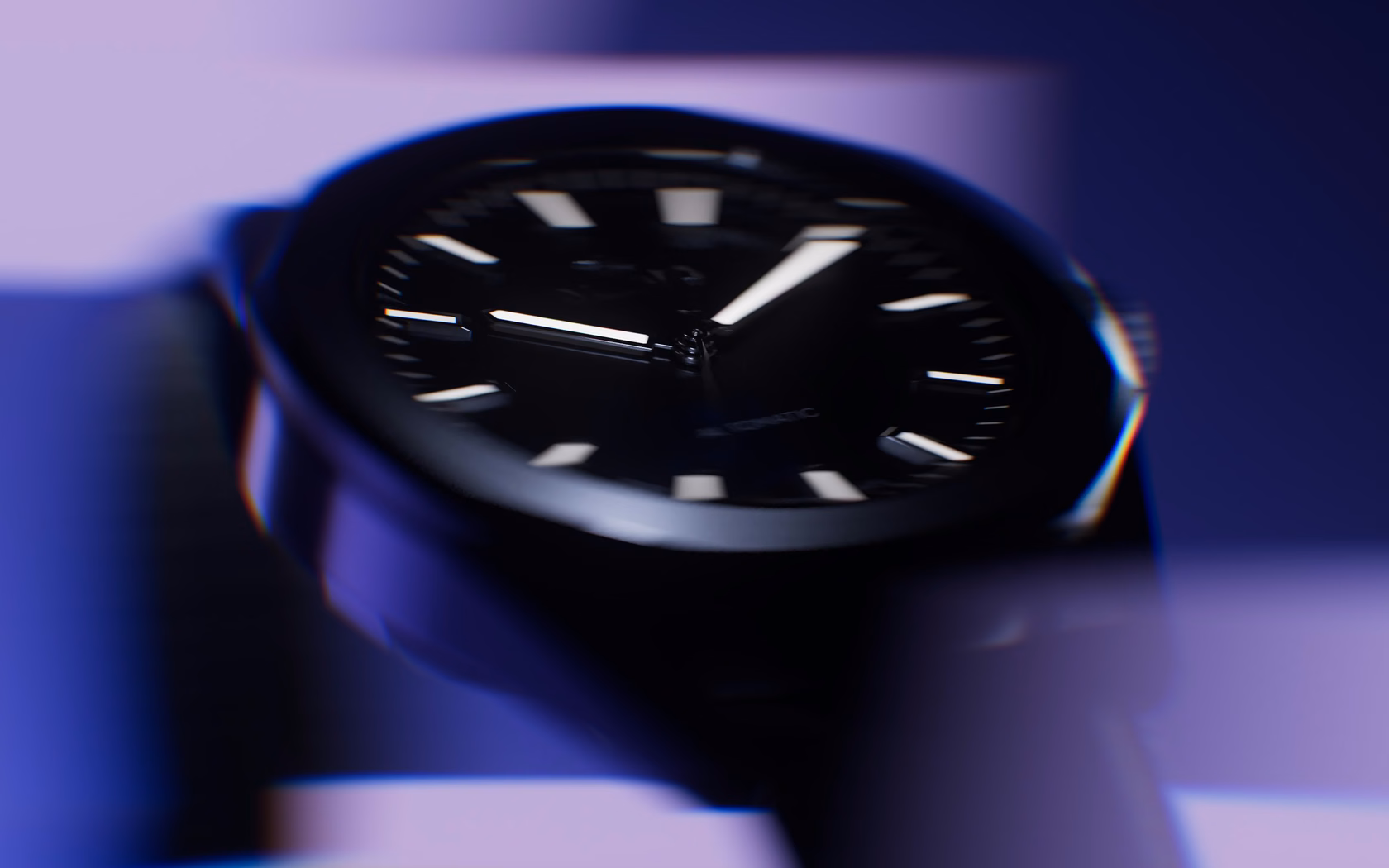 blurred watch prototype under colored light showing form and depth