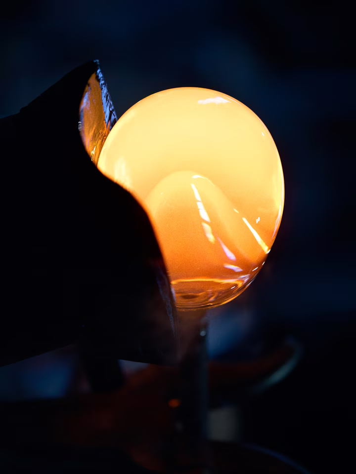 molten glass bubble forming under intense heat and controlled light
