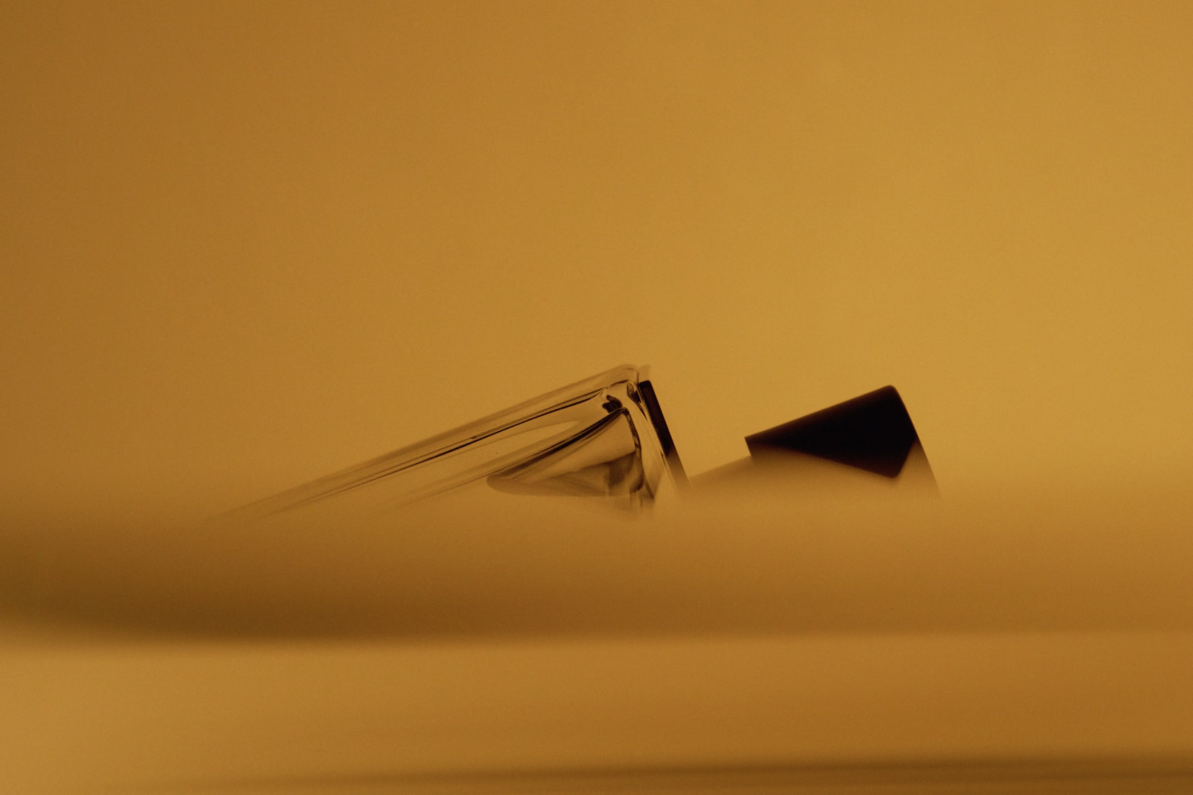 abstract light through liquid creating warm refractive patterns
