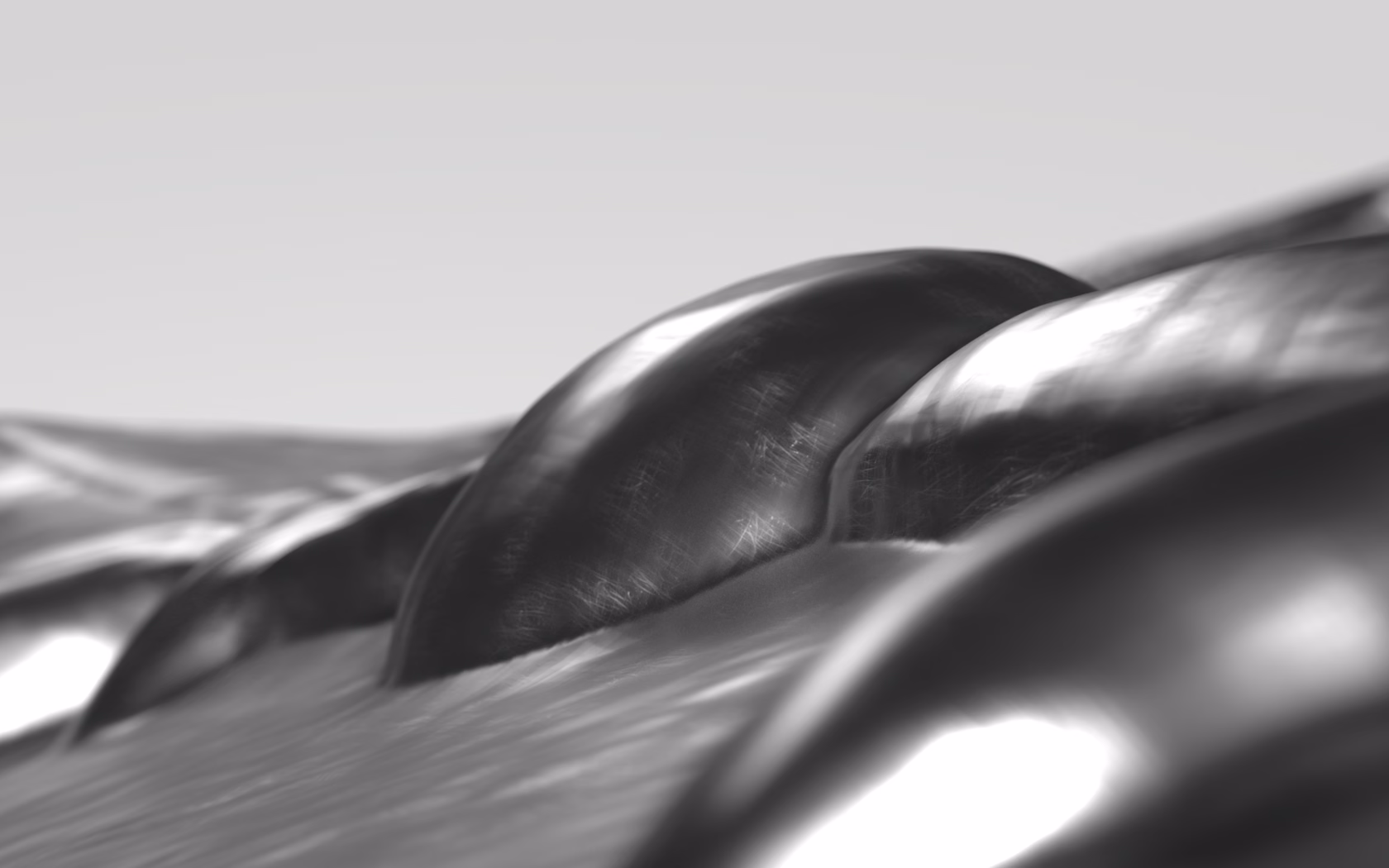 CGI polished metal forms with smooth curved surfaces and soft reflections